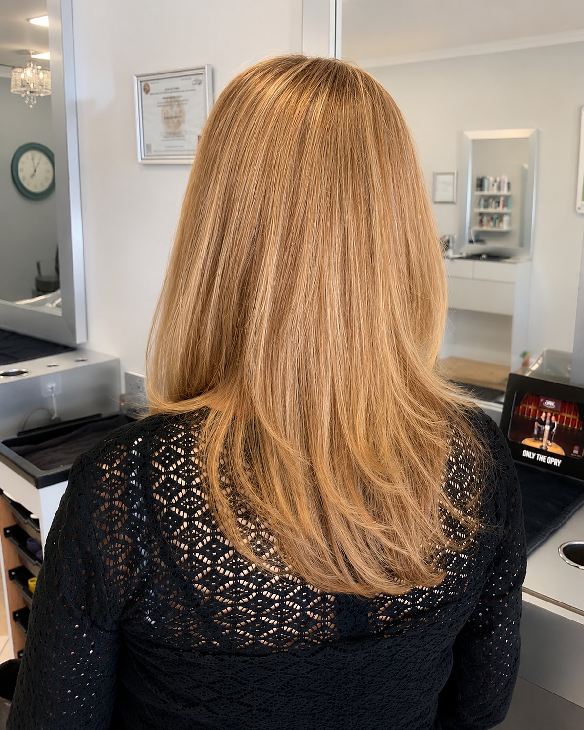Long blonde with layers cut through the interior — Toucheé Organic Salon, Juno Beach