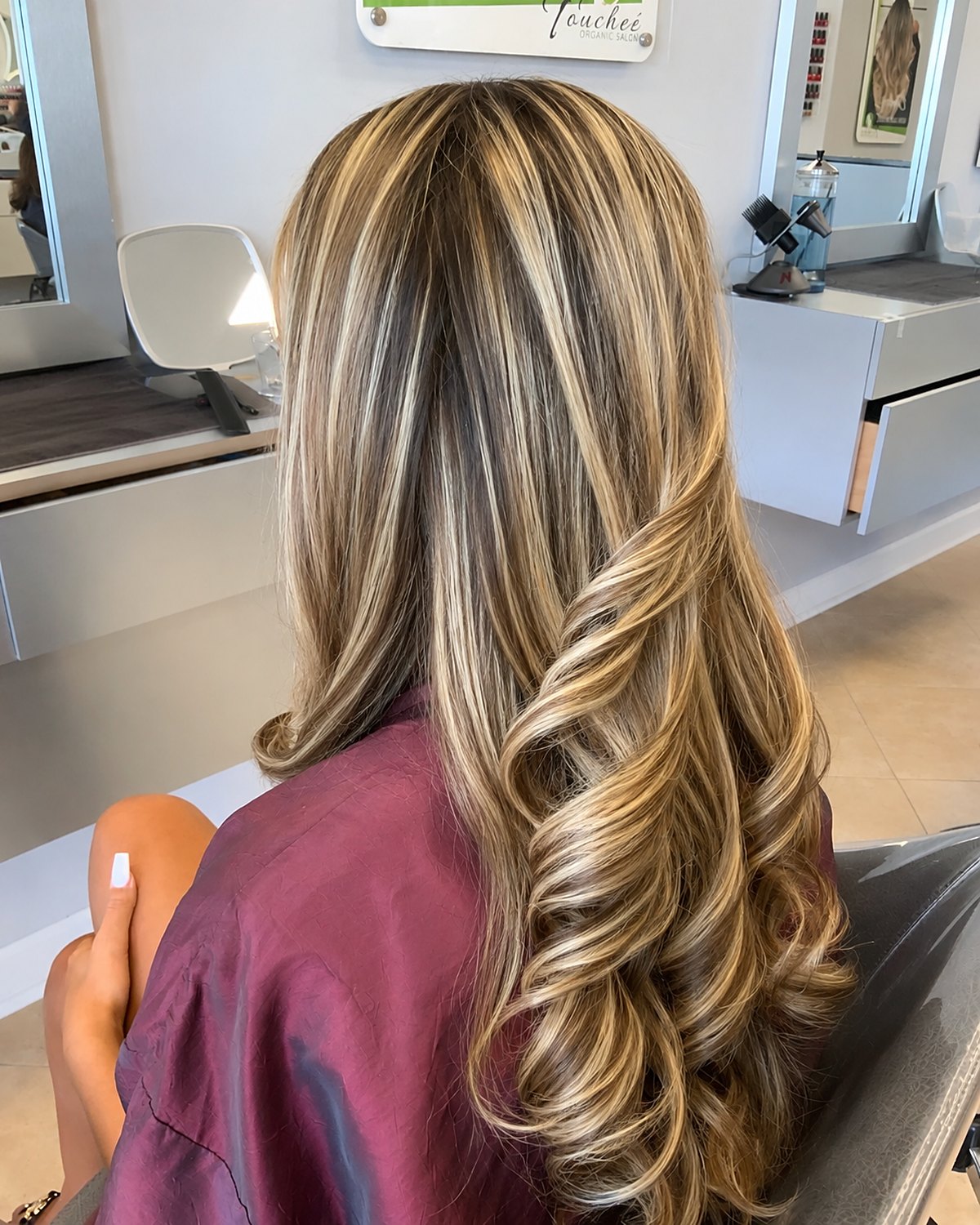 Golden toffee blonde — warm, expensive and deliberately low maintenance — Toucheé Organic Salon, Juno Beach