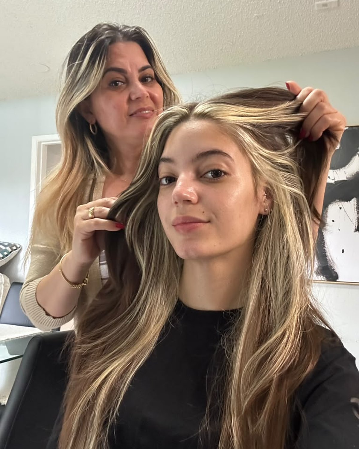 Nancy placing a money piece through the face frame — Toucheé Organic Salon, Juno Beach