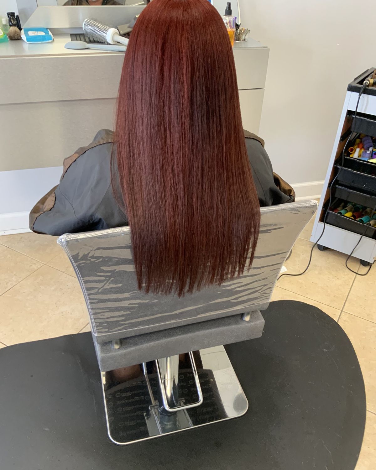 Deep red worn long and glossy — Toucheé Organic Salon, Juno Beach