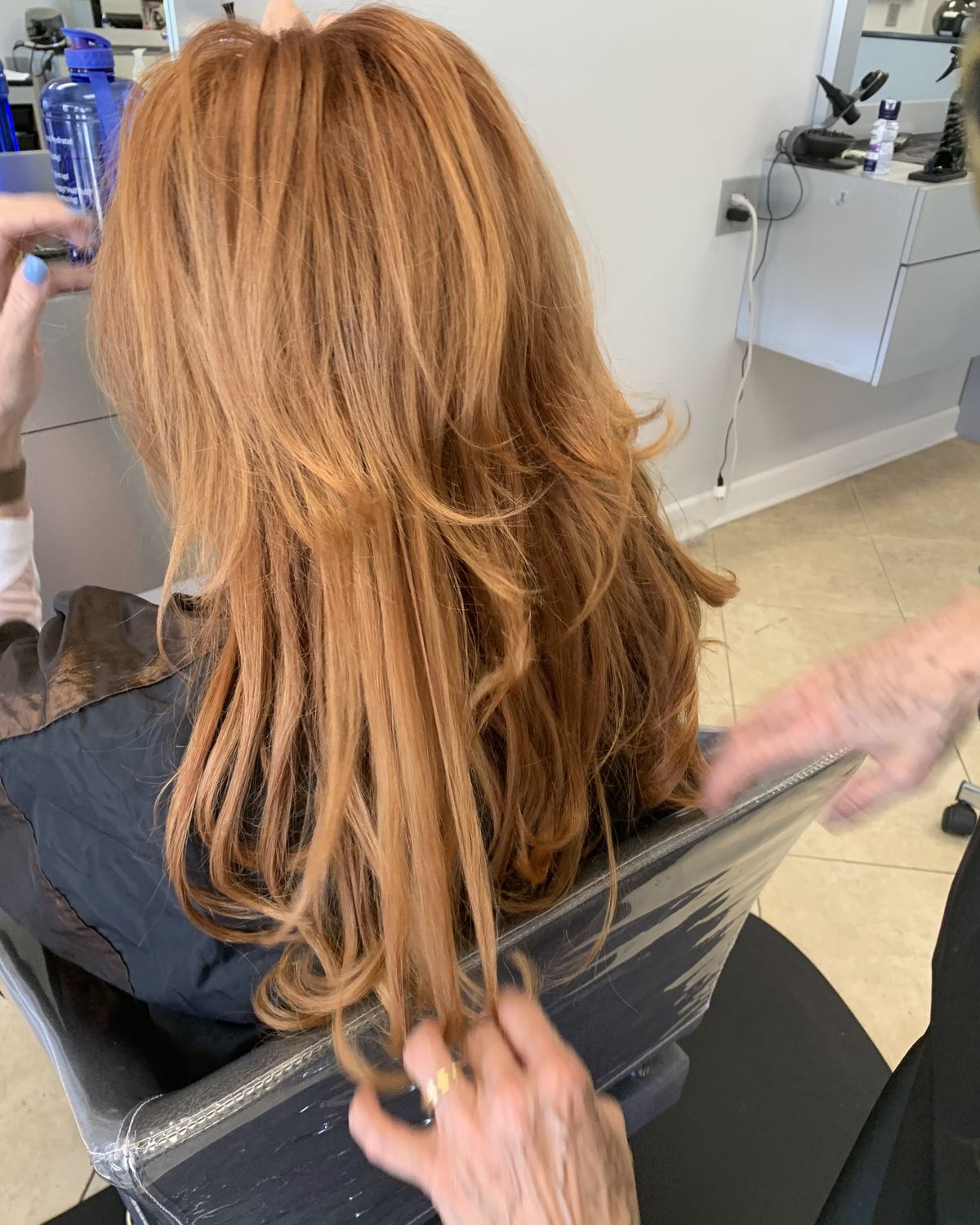 Strawberry copper being worked through at the chair — Toucheé Organic Salon, Juno Beach